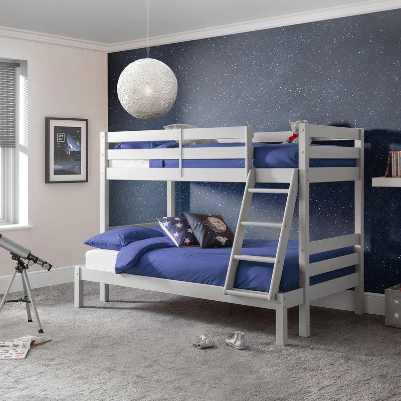 Triple sleeper bunk bed in dove grey with a sturdy wooden frame, featuring two upper sleeping areas with blue bedding and a lower double bed, accompanied by a side ladder.