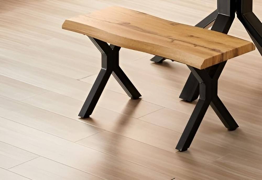 Durable wooden bench with a brown curved edge top and X-shaped black iron legs, suitable for dining, work, or study.
