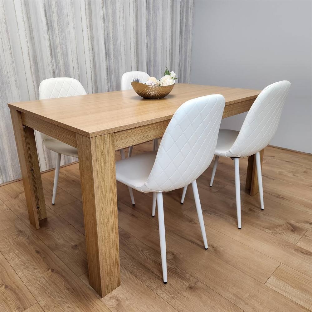 KOSY KOALA wooden dining table in oak effect with four white gem-patterned chairs, featuring a sleek design and a size of 140cm x 80cm, set against a light wooden backdrop.