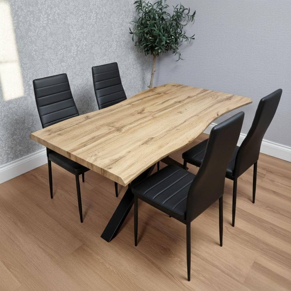 Kosy Koala wooden dining table in brown with a unique edge design, accompanied by four black leather chairs with sleek metal legs, set against a light gray wall.