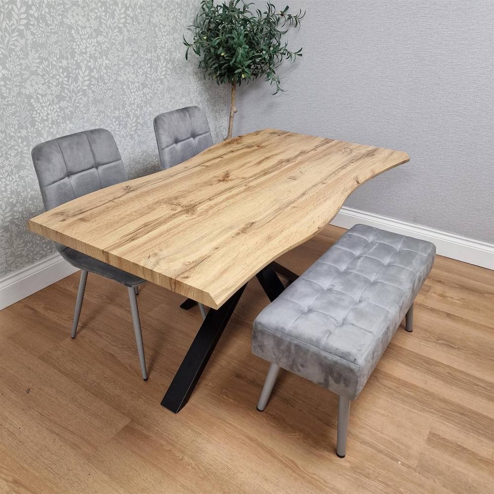 Kosy Koala wood dining set featuring a natural wood table with a unique edge, complemented by tufted grey velvet chairs and a matching grey velvet bench.