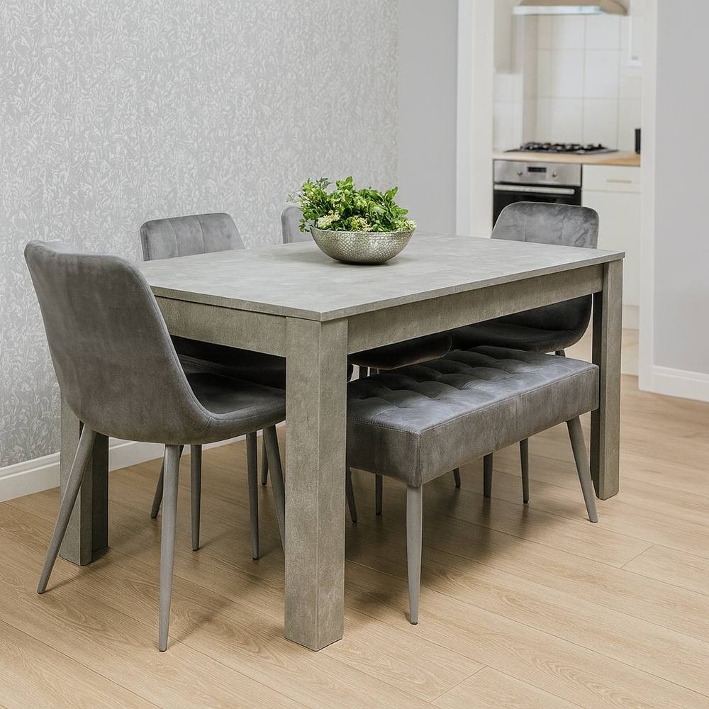 Grey wooden dining table set featuring four grey upholstered chairs and a matching bench, complemented by a decorative bowl of greenery on the table.