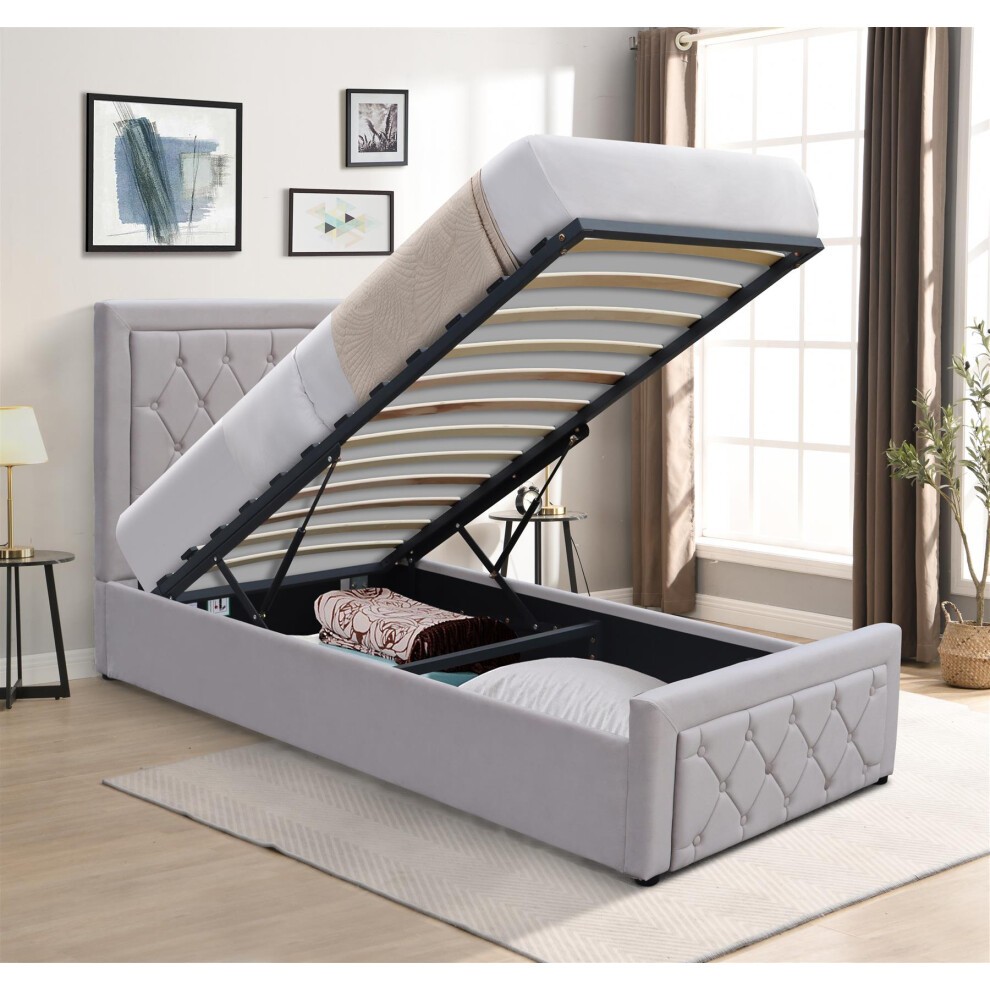 Grey velvet ottoman storage bed with a gaslift mechanism, featuring a 3ft memory foam mattress, showcasing a tufted headboard and ample storage space underneath.