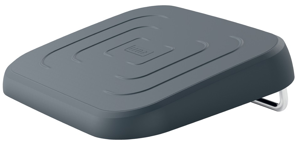 Ergonomic adjustable footrest in black with a textured surface and curved edges, featuring a sturdy metal base for stability in an office setting.