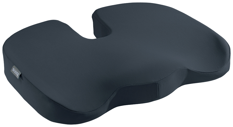 Grey ergonomic orthopedic seat cushion with a contoured shape for comfort, featuring a soft fabric cover and a cut-out section for improved posture support.
