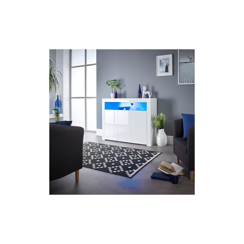 Modern white sideboard cabinet with LED lighting, featuring a sleek design, glossy finish, two doors, and situated in a stylish room with a black and white patterned rug.