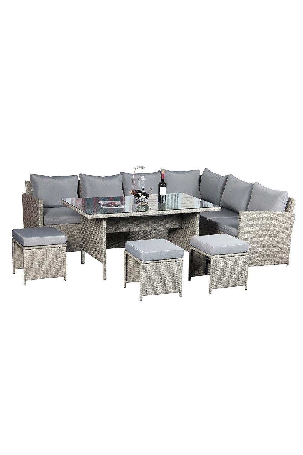 Grey rattan corner dining set with nine seats, featuring plush cushions, a glass-topped table, and two matching ottomans, ideal for outdoor dining.