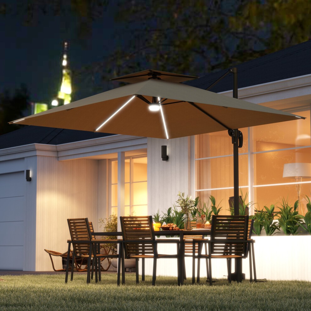 Khaki 2.5m cantilever parasol with built-in lights, featuring a sturdy frame and a large canopy, positioned over a dining table and chairs in a garden setting at night.