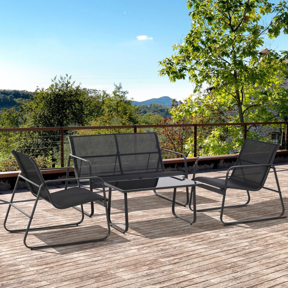 Black metal patio furniture set featuring a sofa and two chairs with mesh fabric, complemented by a glass top table, set against a scenic outdoor backdrop.
