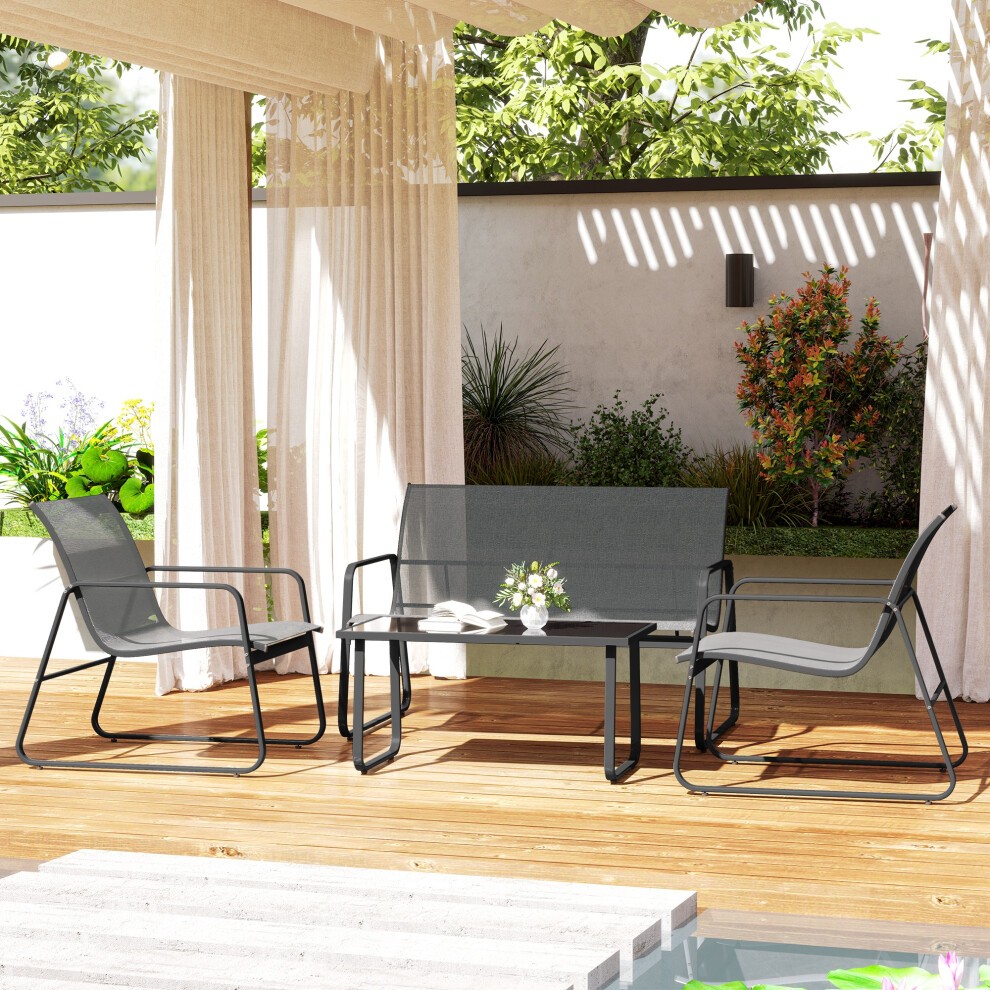 Grey 4-piece garden furniture set featuring a glass top table and two chairs with a sleek metal frame, set on a wooden patio surrounded by greenery.