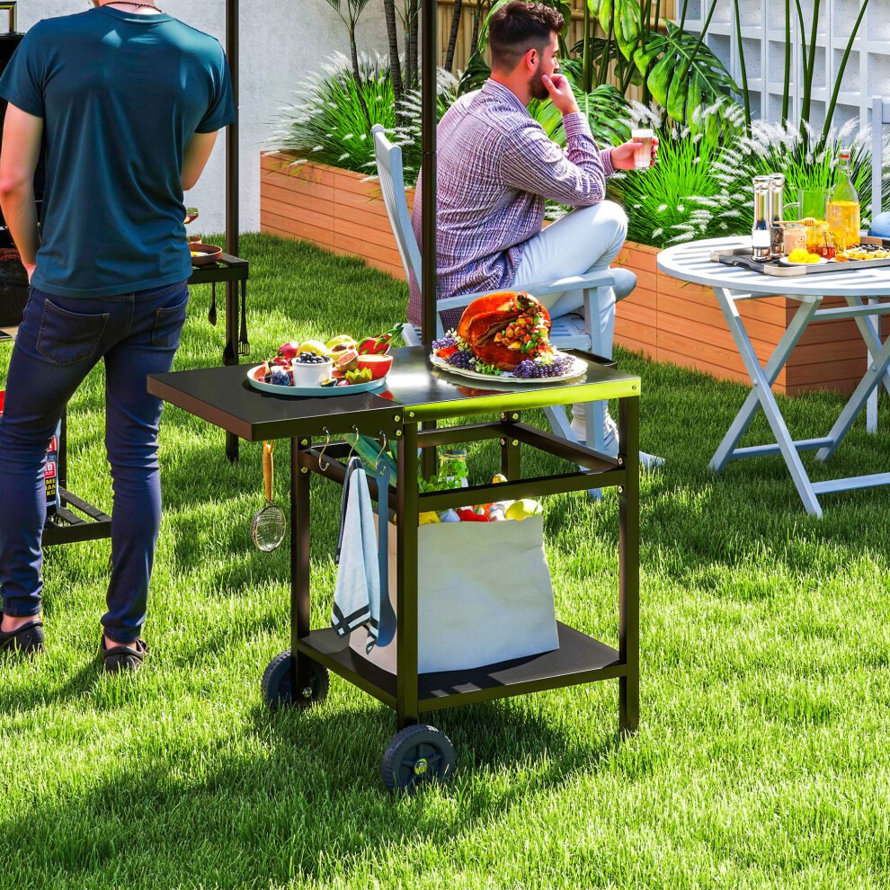 Black Outsunny BBQ trolley featuring a foldable side table and movable pizza table, with sturdy wheels for easy mobility, set on a grassy outdoor area.