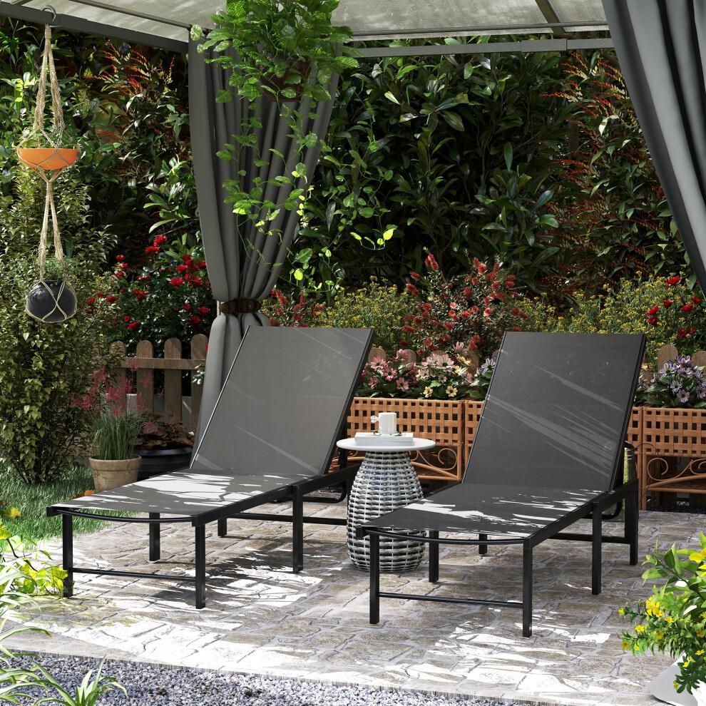 Two grey Outsunny sun loungers with a 5-level reclining feature, made of durable materials, positioned under a canopy in a garden setting with greenery and decorative elements.