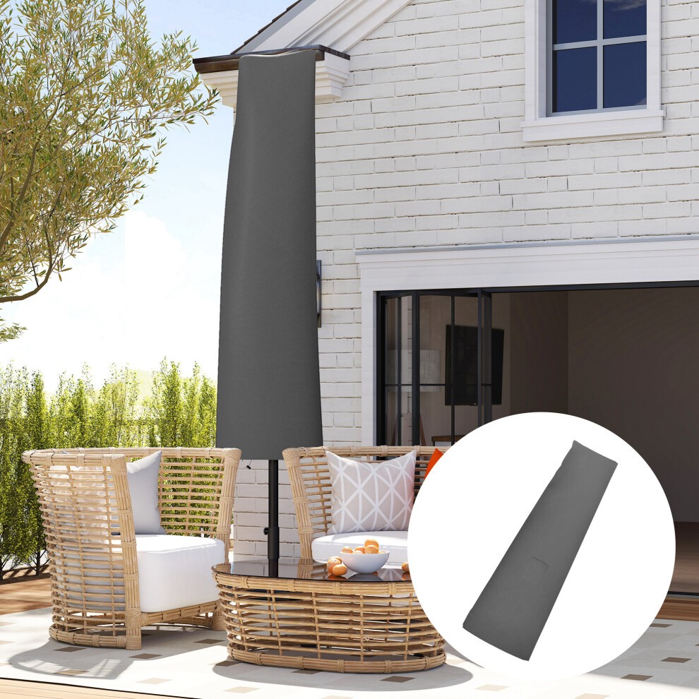 Grey parasol umbrella cover made of durable material, designed for outdoor protection, featuring a sleek, elongated shape, positioned beside a patio area with wicker furniture.