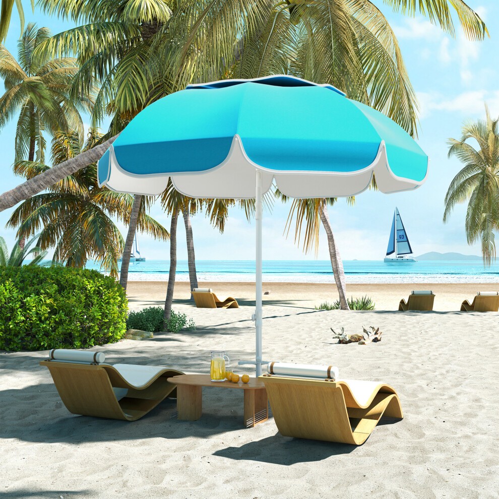 Blue and white adjustable beach umbrella with a tilt feature, set on a sandy beach near palm trees, alongside two lounge chairs and a small table with drinks.