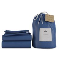 Deep Sea Navy bamboo bedding set by Panda, featuring a king size with a smooth texture, neatly folded sheets, and a matching storage bag with a tag.