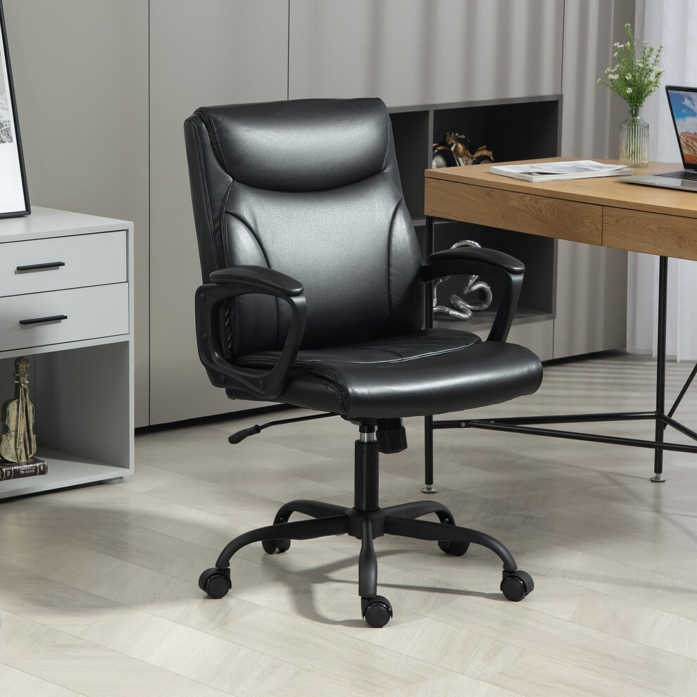 Black faux leather desk chair with a tilt function, adjustable height, and armrests, set against a modern office backdrop with a wooden desk and decorative elements.