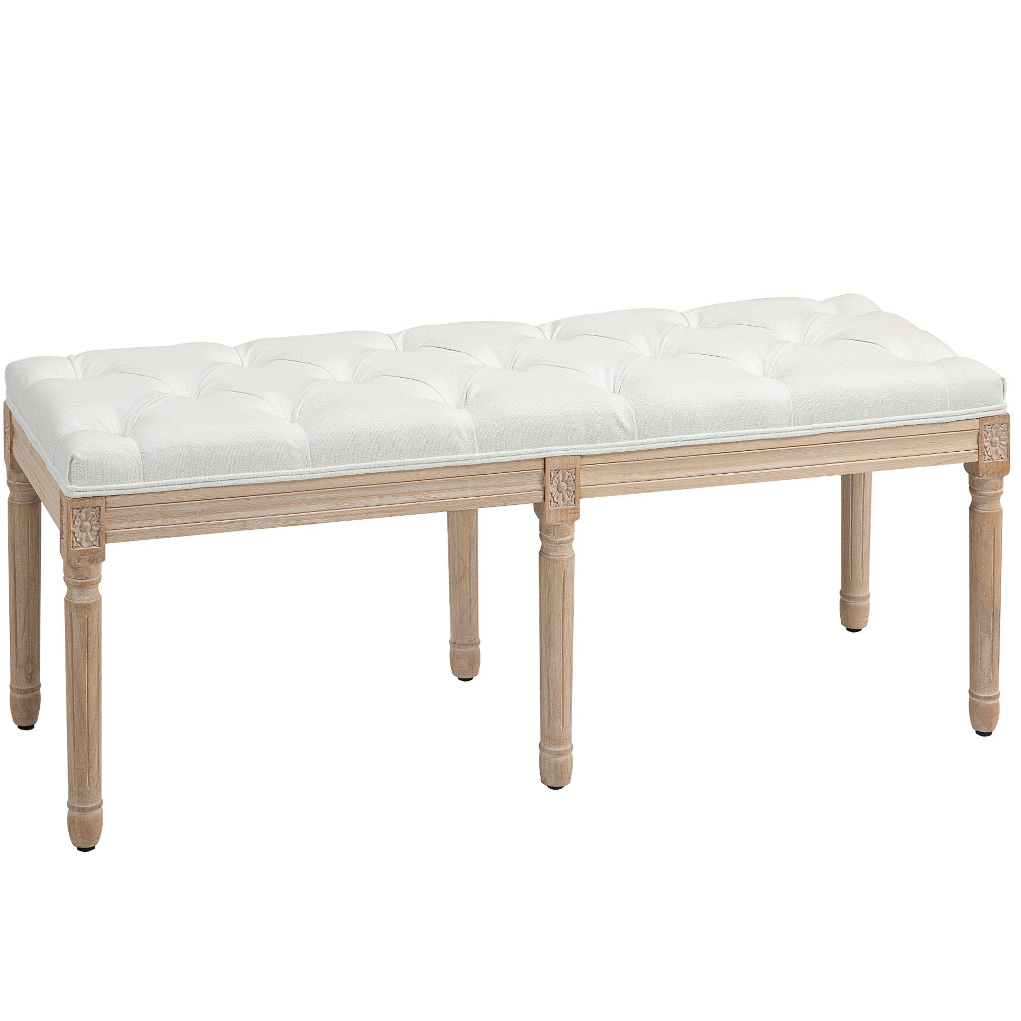 Upholstered cream white bench with tufted design, featuring a light wooden frame and carved detailing on the legs, ideal for bedroom or entryway use.