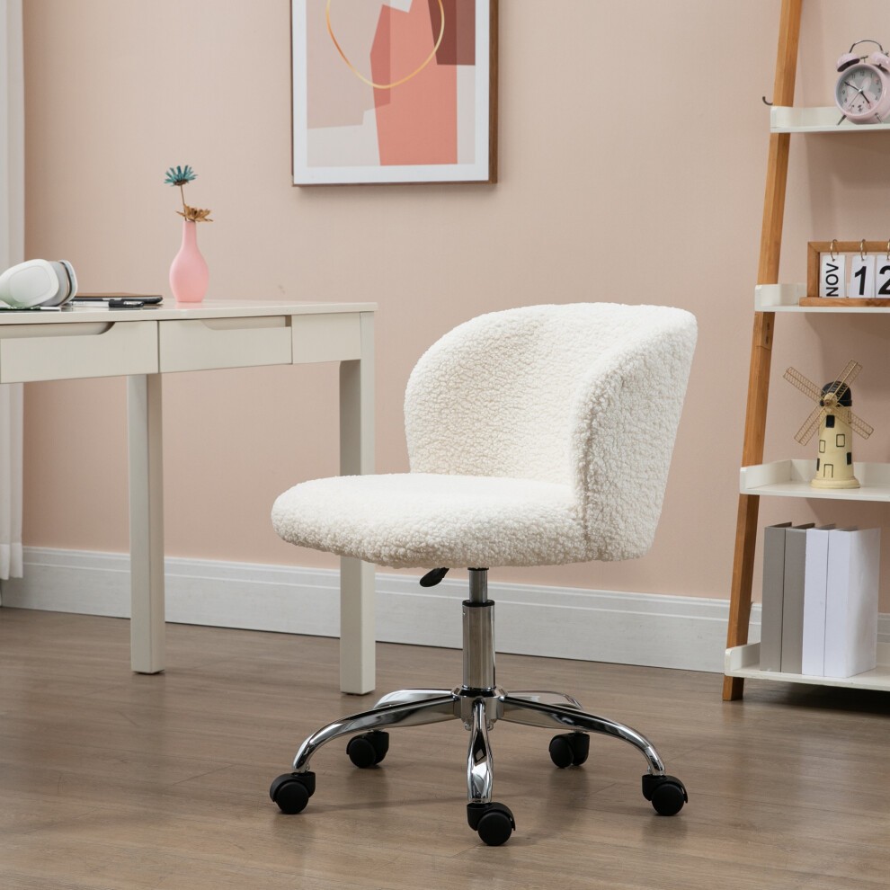White swivel office chair with a plush, textured fabric seat, adjustable height, and rolling wheels, set against a pastel wall and minimalist desk.