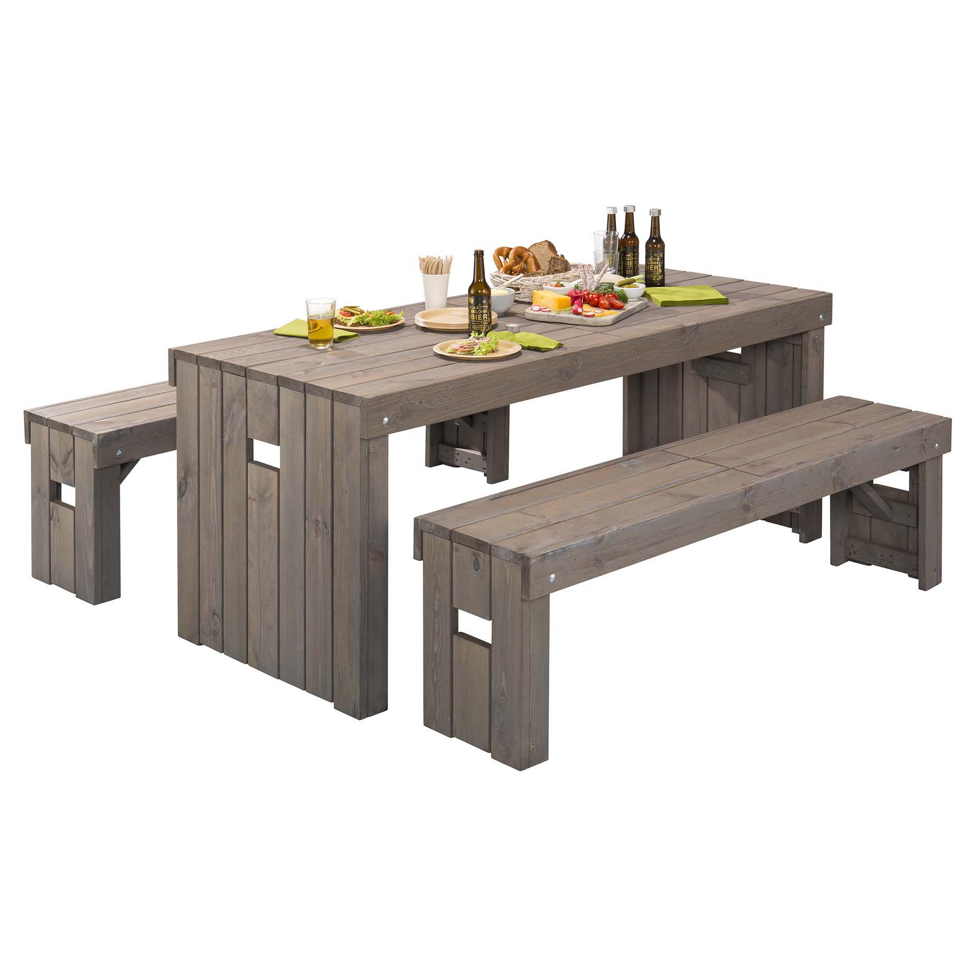 Grey wooden dining table and bench set with a rustic finish, featuring two benches and a table, set with plates, drinks, and snacks for outdoor dining.