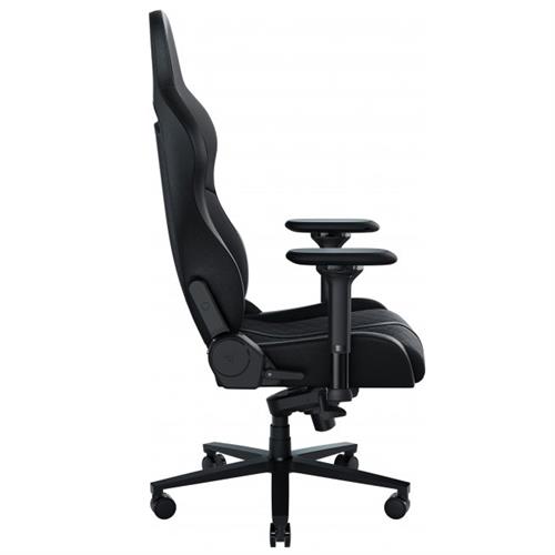 Black upholstered gaming chair with ergonomic design, adjustable armrests, and a sturdy base on wheels, suitable for users up to 136 kg. Height adjustable from 128 cm to 138 cm.