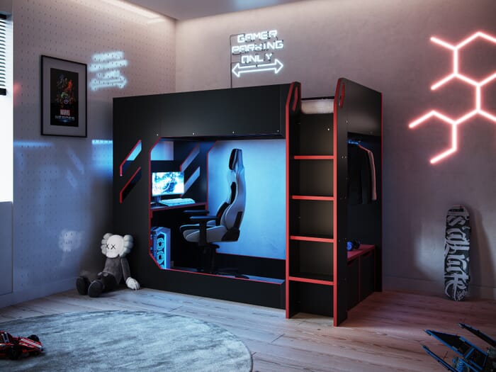 High sleeper single bed in black with red accents, featuring a built-in desk area, shelving, and a modern gaming chair visible underneath.