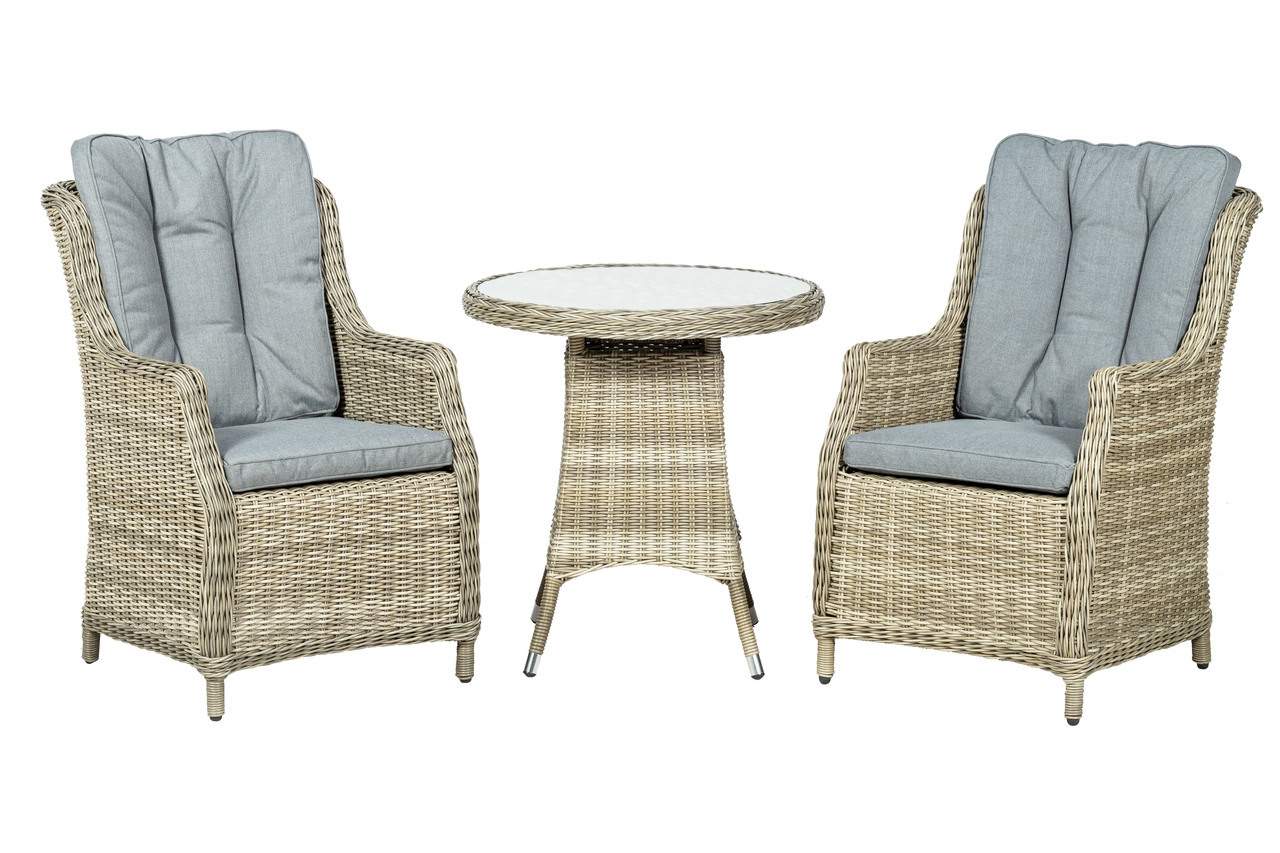 Two highback wicker chairs with light grey cushions flanking a round wicker table with a white top, all in a natural beige finish, ideal for outdoor bistro settings.