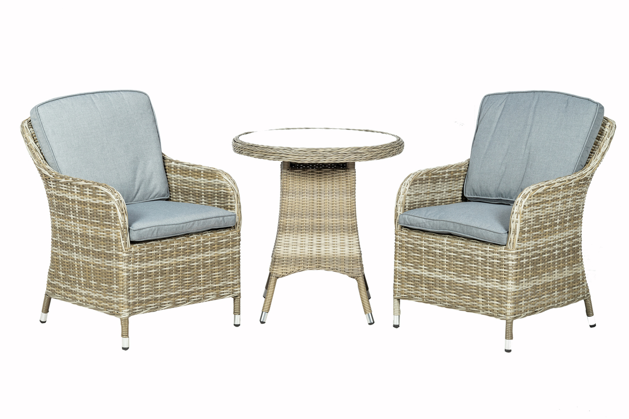 Beige synthetic rattan bistro set featuring two cushioned armchairs with light blue cushions and a round table, ideal for outdoor dining or relaxation.