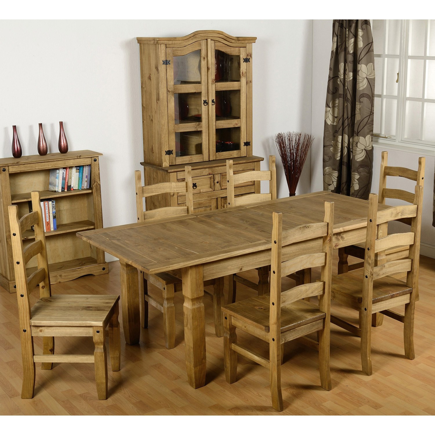 Seconique Corona extending dining set featuring a distressed waxed pine finish, includes a rectangular table and six matching brown chairs with slatted backs.
