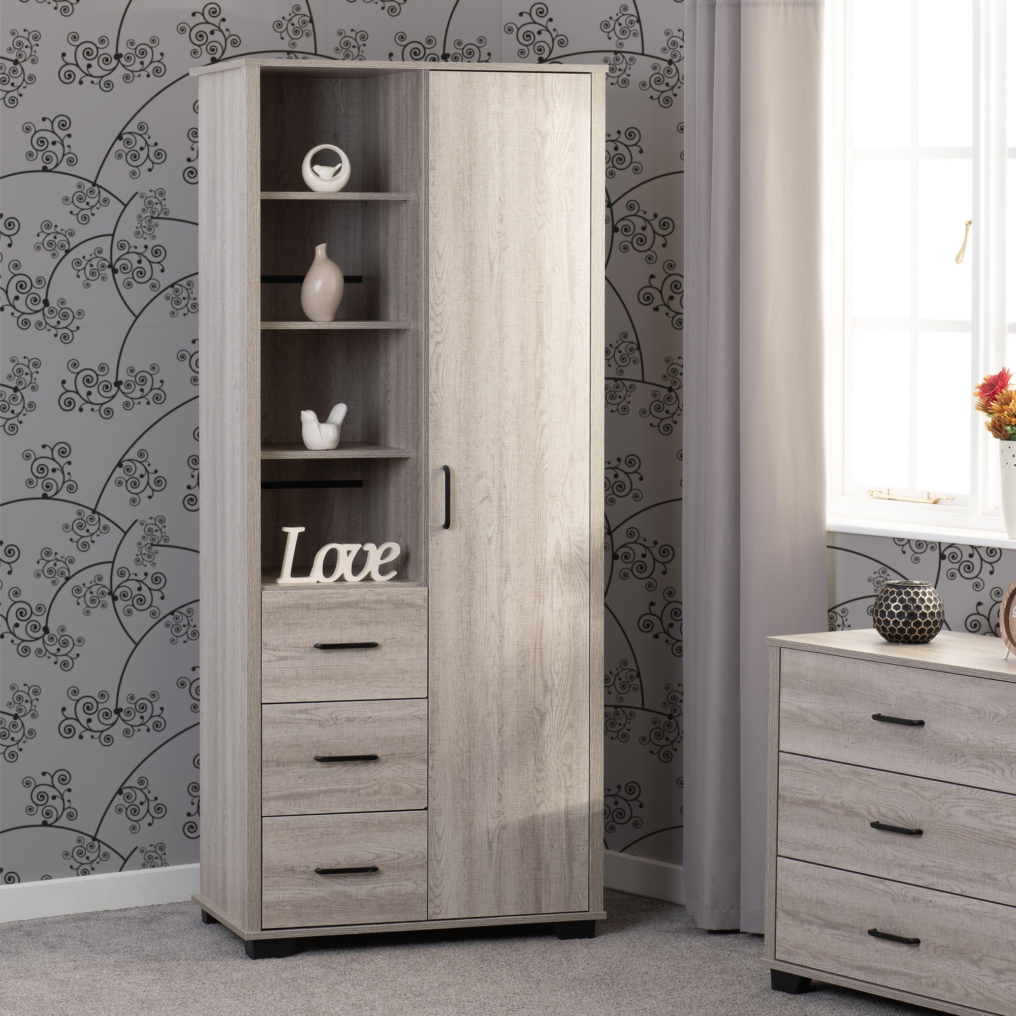 Light oak effect wardrobe featuring one door, three drawers, and open shelves, complemented by a modern design and a neutral brown finish.