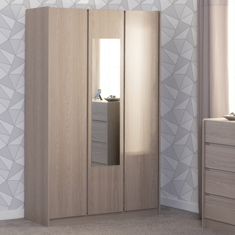 Three-door wardrobe in smoked ash effect with a central mirrored panel, featuring a sleek design and modern finish, set against a geometric wallpaper background.