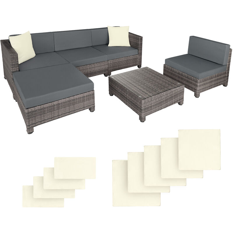 Rattan corner sofa set with an aluminum frame, featuring grey cushions and a matching coffee table, accompanied by four cream-colored cushion covers.