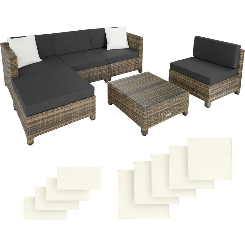 Rattan corner sofa set featuring a brown and black aluminum frame, with gray cushions and two white throw pillows, accompanied by a matching coffee table.