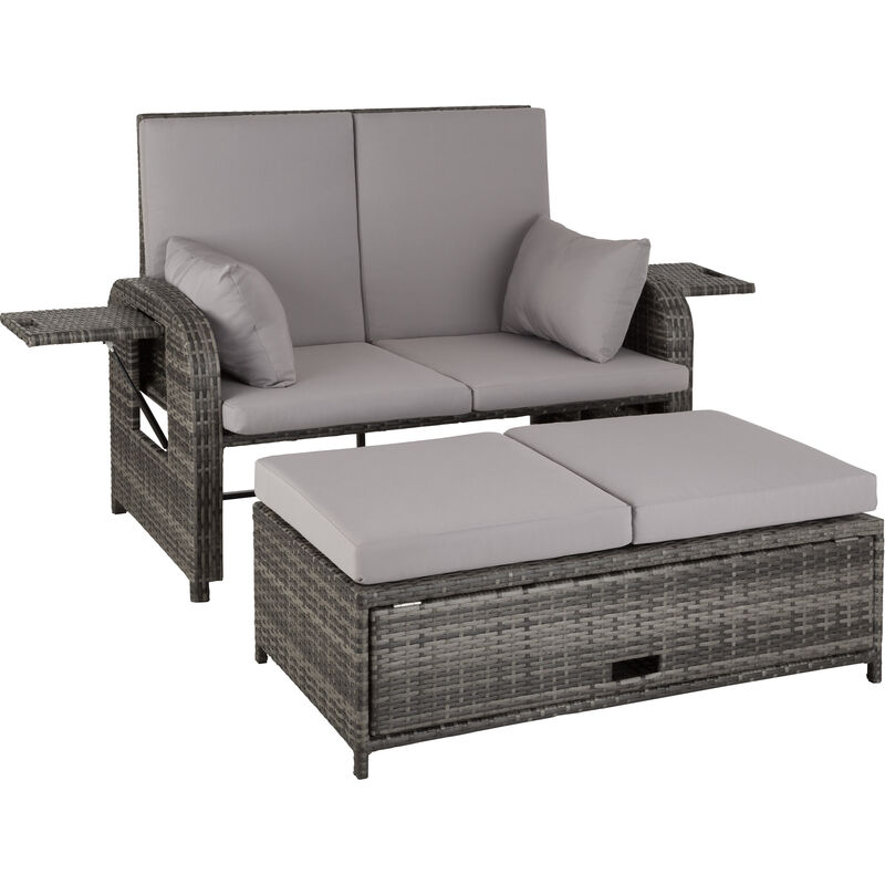 Grey rattan sofa set featuring a two-seater with soft grey cushions, side armrests, and a matching storage ottoman with a flat top.