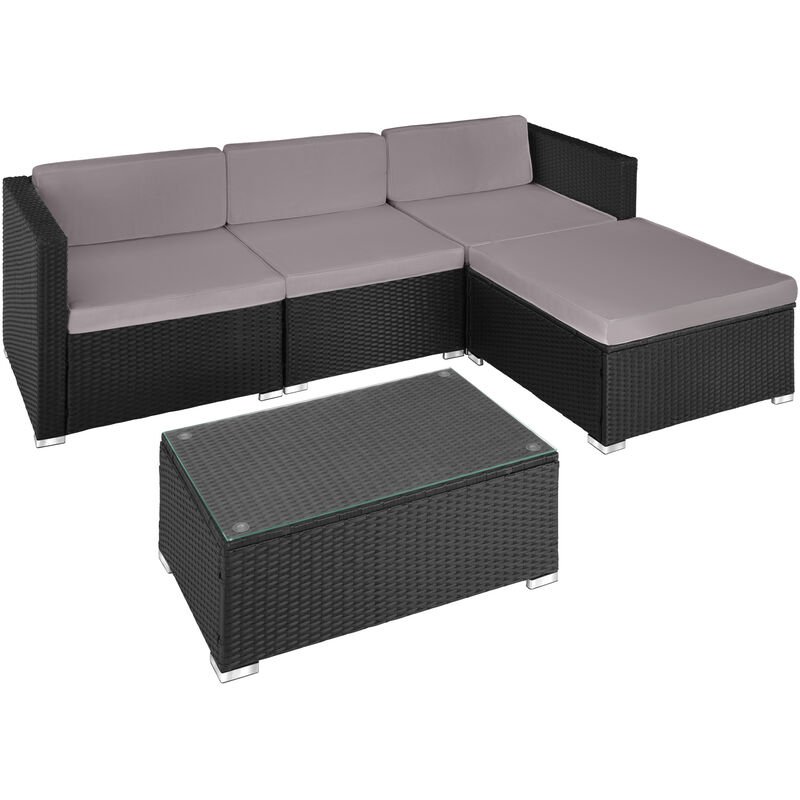 Black and grey rattan lounge sofa set featuring a modular design with plush cushions and a glass-top coffee table, ideal for outdoor relaxation.