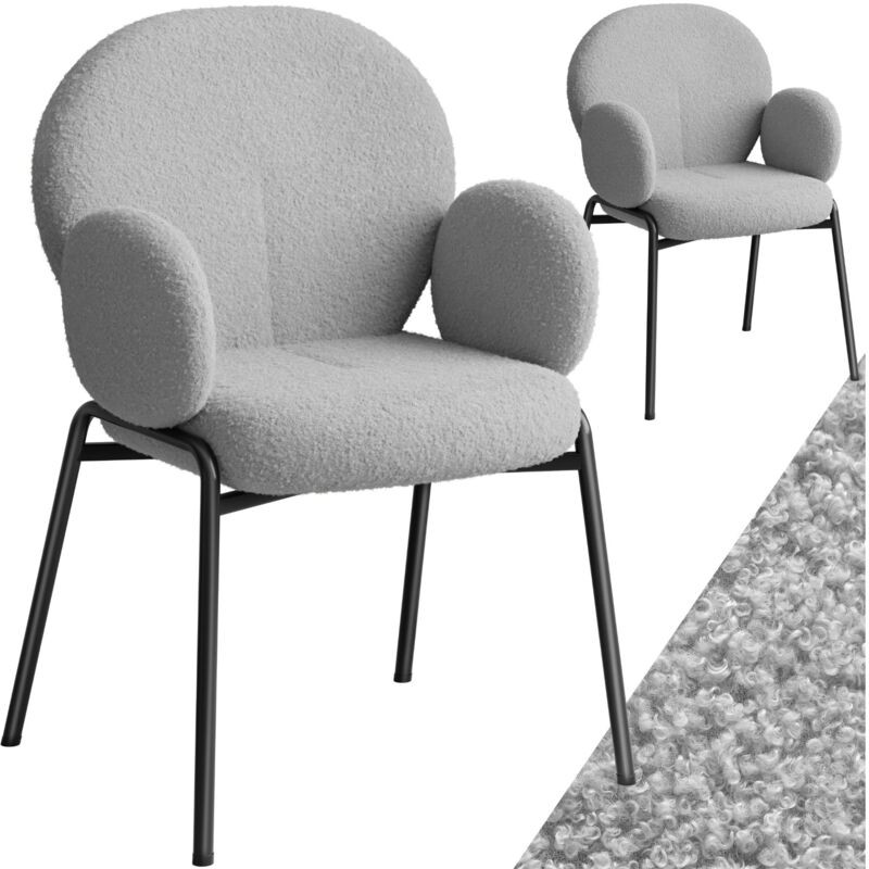 Two grey padded dining chairs with boucle fabric covers and rounded backs, featuring black metal legs for a modern Scandi design.