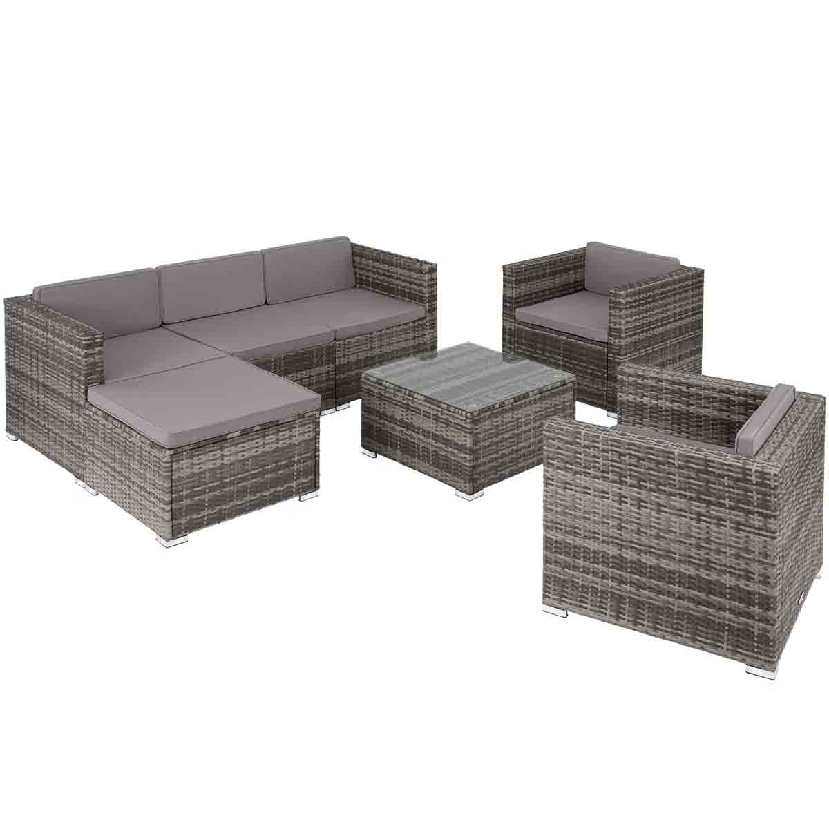 Grey rattan garden furniture set featuring a corner sofa, two armchairs, and a square coffee table with a glass top, all with soft grey cushions for outdoor dining.