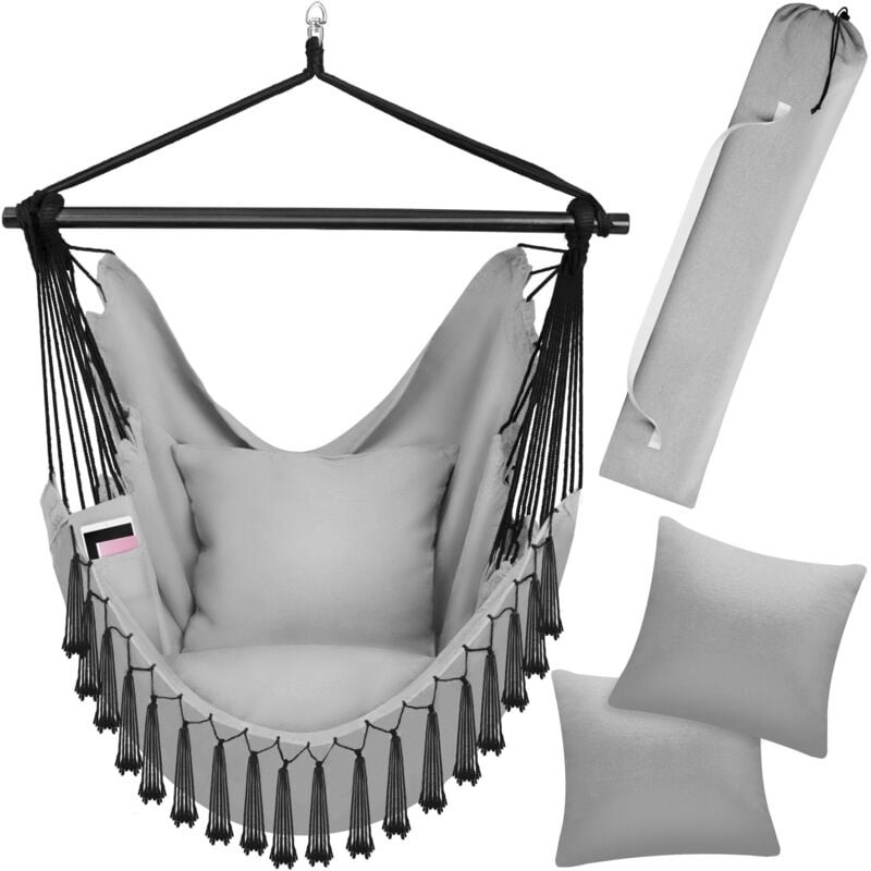 Boho-style hanging chair in grey with a sturdy black frame, featuring decorative fringes, two plush cushions, and a load capacity of 150kg.