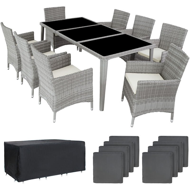 Light grey rattan 8-seater furniture set featuring a rectangular table with a glass top, eight cushioned chairs, and a protective black cover.