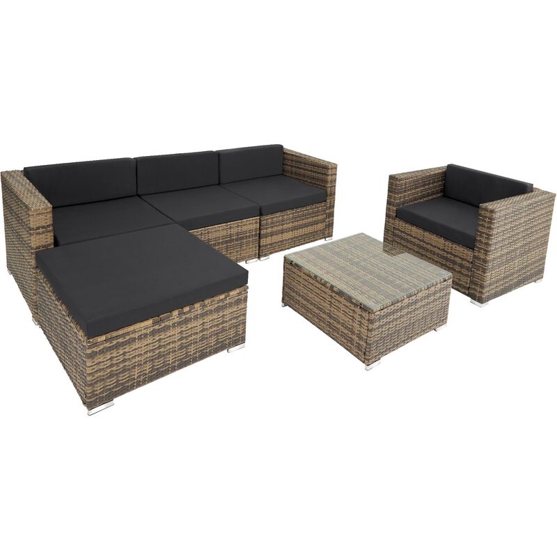 Cream rattan garden furniture set featuring a sectional sofa with black cushions, a matching armchair, and a glass-top coffee table.