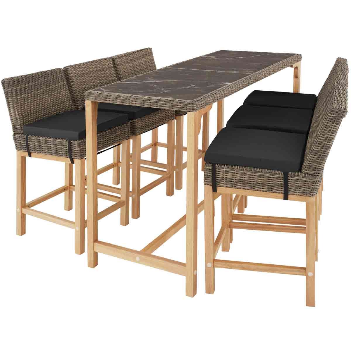 Brown wicker bar table with a marble-like top, accompanied by six matching bar stools featuring black cushions and wooden legs.