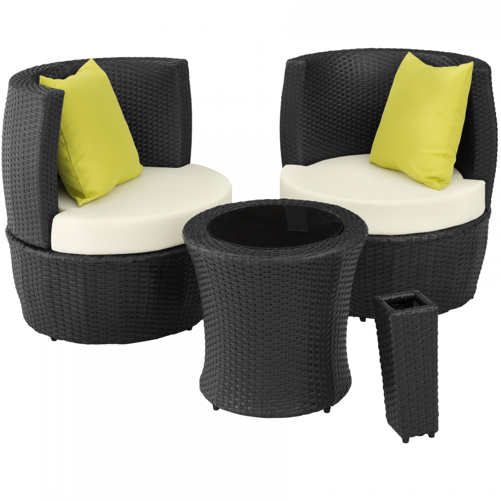Black rattan bistro set featuring two curved chairs with cream cushions and bright yellow throw pillows, accompanied by a matching round table and a tall planter.