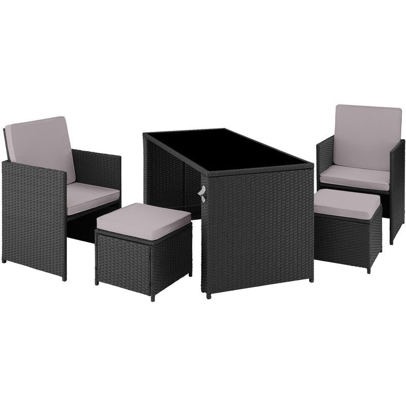 Black and grey rattan seating set featuring two armchairs, a matching ottoman, and a rectangular table with a glass top, all with soft cushions for comfort.
