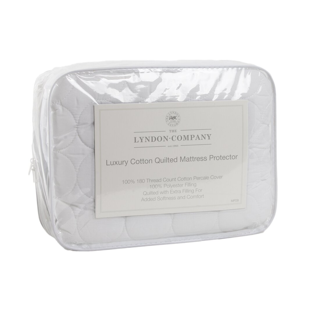 Luxury white cotton quilted mattress protector by The Lyndon Company, featuring a 180 thread count cotton percale cover and 100% polyester filling, packaged in a clear zippered bag.