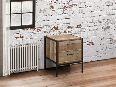 Birlea Urban Industrial Design bedside cabinet featuring a metal frame, two wooden drawers with a natural finish, set against a white brick wall and wooden floor.