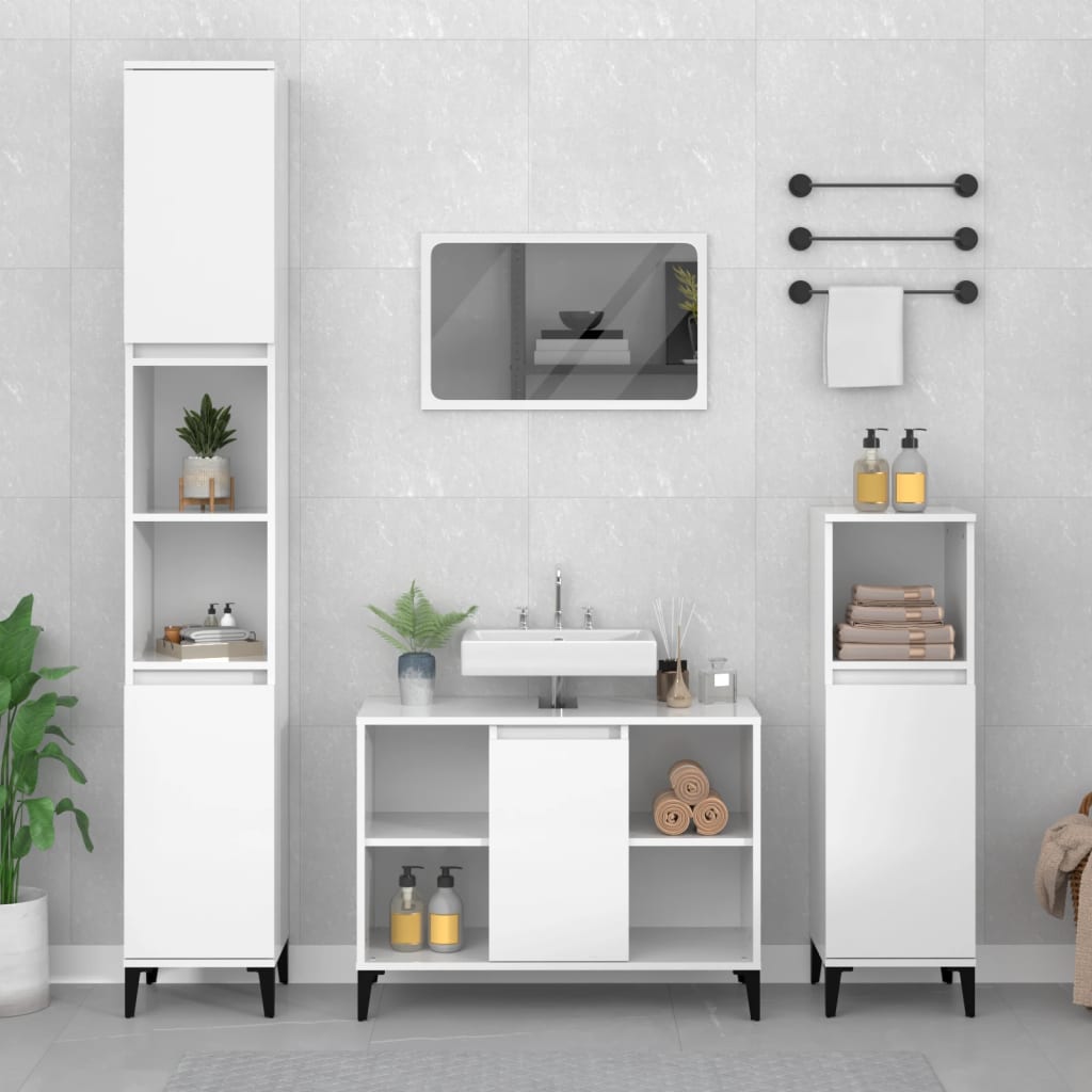 High gloss white sink cabinet made of engineered wood, featuring a minimalist design with a central sink, storage compartments, and sleek black legs, set against a light gray tiled wall.