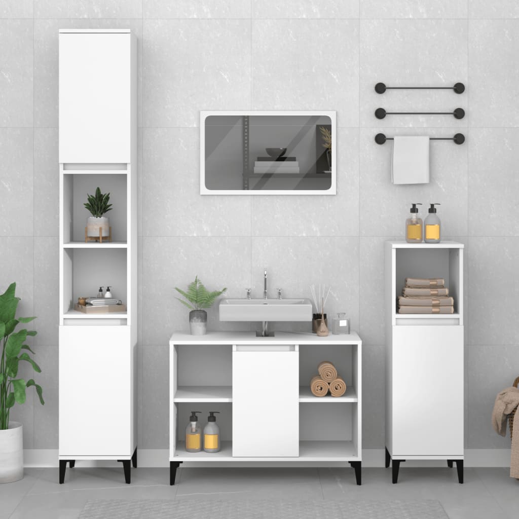 White sink cabinet made of engineered wood, measuring 80x33x60 cm, featuring a sleek design with sliding doors, complemented by tall storage units and decorative plants.