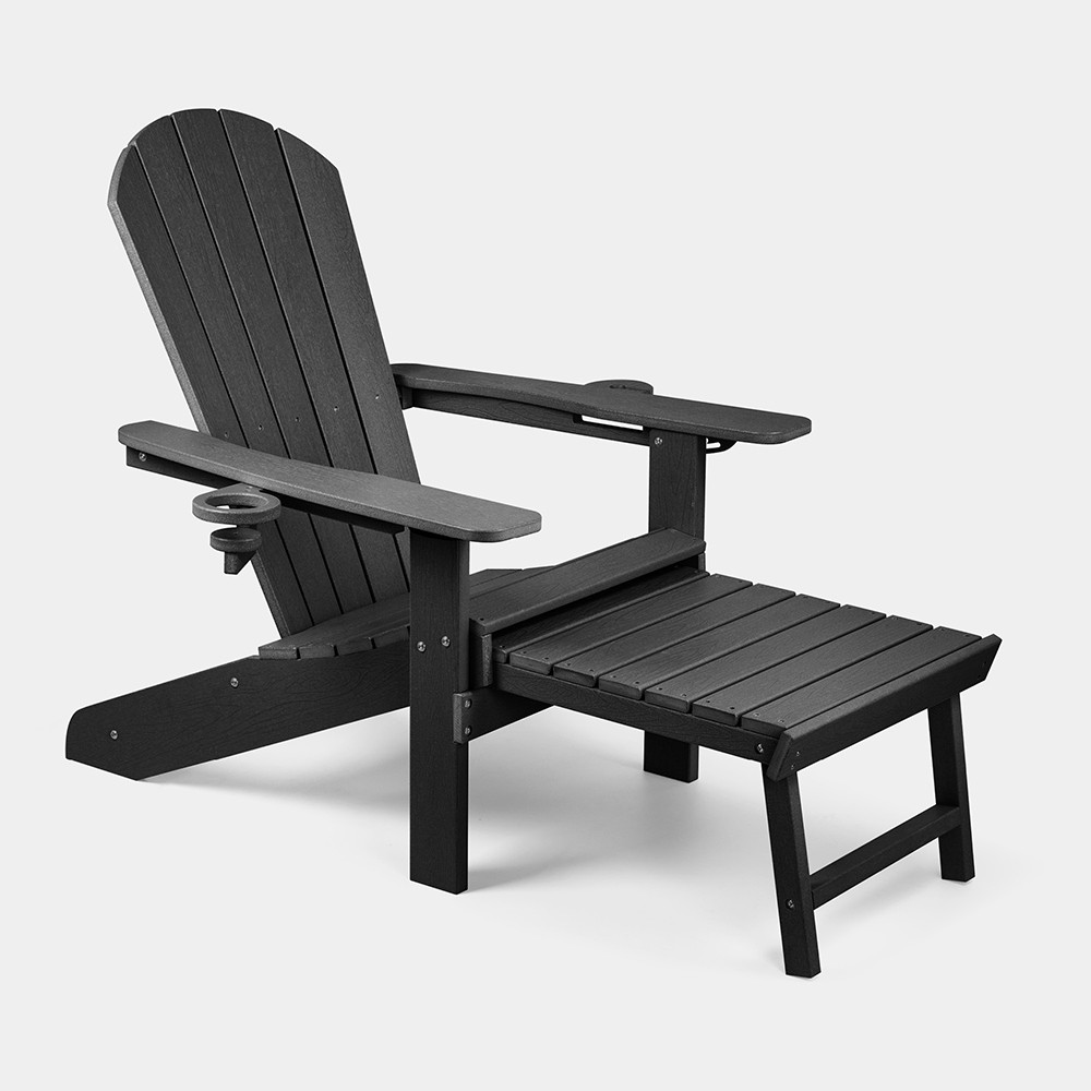 Black Adirondack chair made of durable material, featuring a slatted backrest, wide armrests, and a pull-out footrest for added comfort.