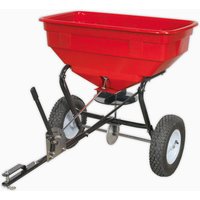 Red Sealey tow-behind broadcast spreader with black frame, two large wheels, and a 57kg capacity hopper.