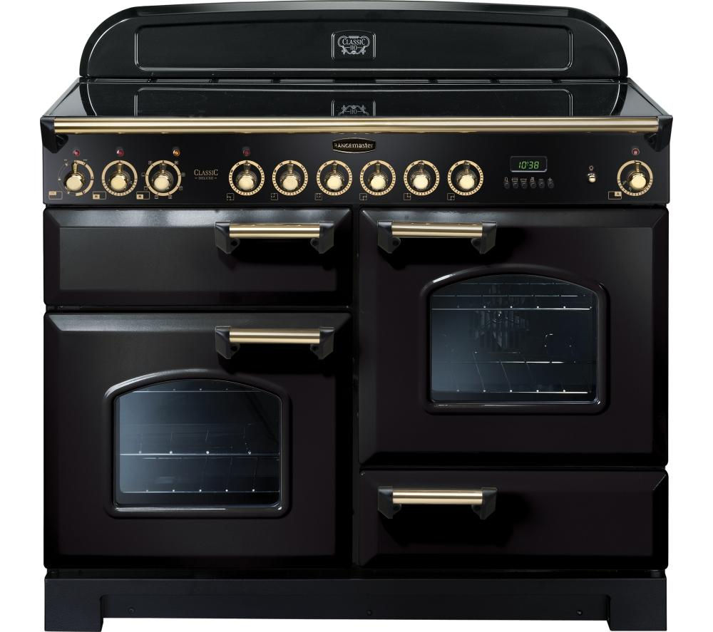 Classic Deluxe 110cm ceramic range cooker in black with brass trim, featuring multiple knobs, digital display, and two glass-fronted ovens.