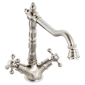 Brushed nickel kitchen mixer tap with a curved spout, decorative handle design, and dual cross handles for hot and cold water control.